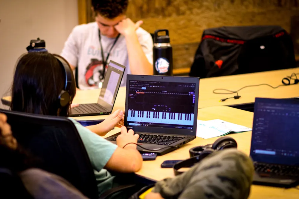 Students focus on music production software during an LTBB learning session.