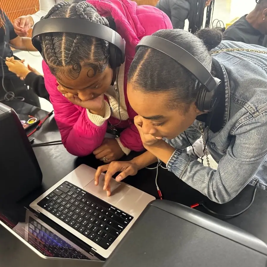 High school students work in a music technology learning environment.