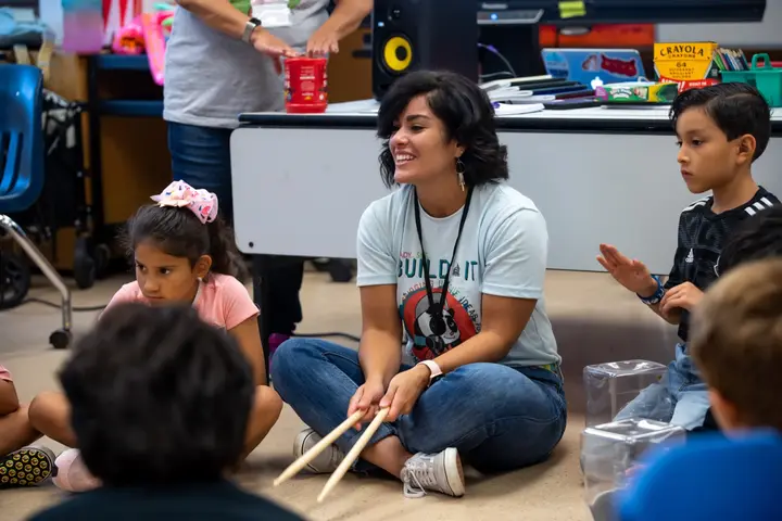 An LTBB educator leads elementary students through a hands-on rhythm activity.