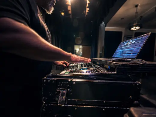 A DJ mixes music during a BUILD IT UP Live experience.